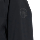 Close up of the black jacket, showing texture of the polyester fabric