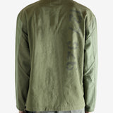 Green shirt worn by a person, showing the shirt's fit