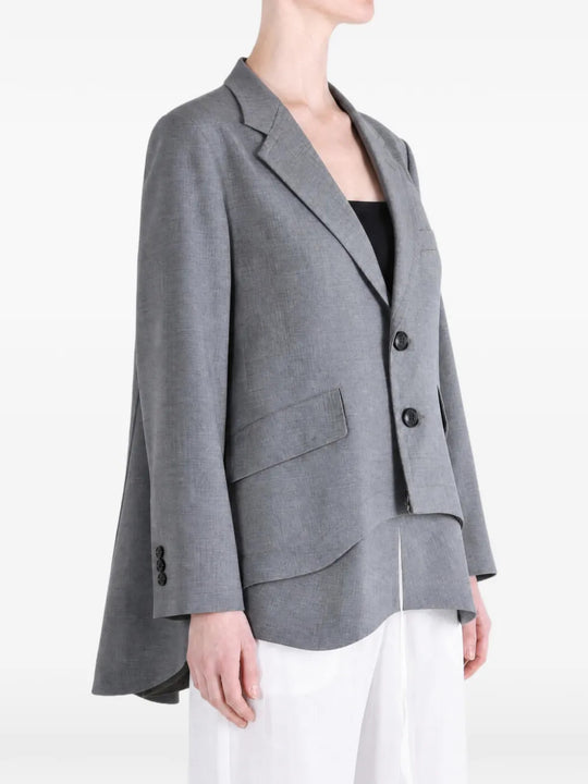 Grey jacket worn by a person, showing the jacket fit