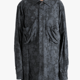 Grey shirt worn by a person, showing the shirt fit