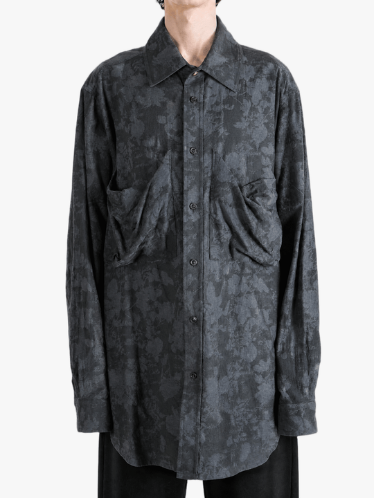 Grey shirt worn by a person, showing the shirt fit