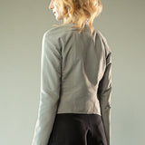Grey jacket worn y a person, showing the jacket's fit