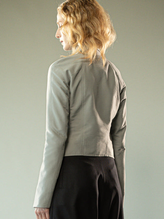 Grey jacket worn y a person, showing the jacket's fit