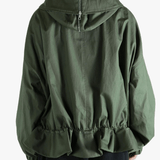 Green jacket worn by a person, showing the jacket's fit