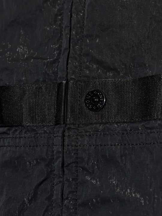 Close up of Black jacket, showing texture of the 100% polyamide fabric