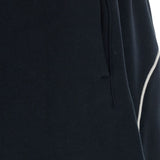 Close up of black shorts, showing texture of the cotton fabric