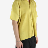 Yellow shirt worn by a person, showing the shirt's fit