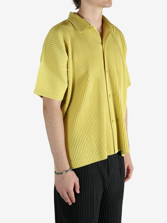 Yellow shirt worn by a person, showing the shirt's fit