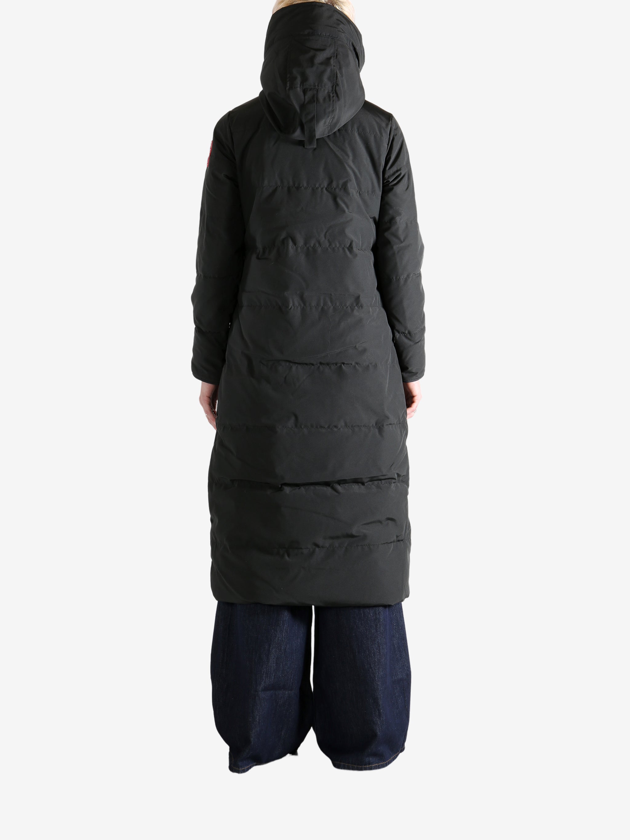 Black jacket worn by a person, showing the jacket's fit