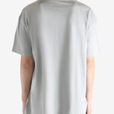 Grey t-shirts worn by a person, showing the t-shirts fit