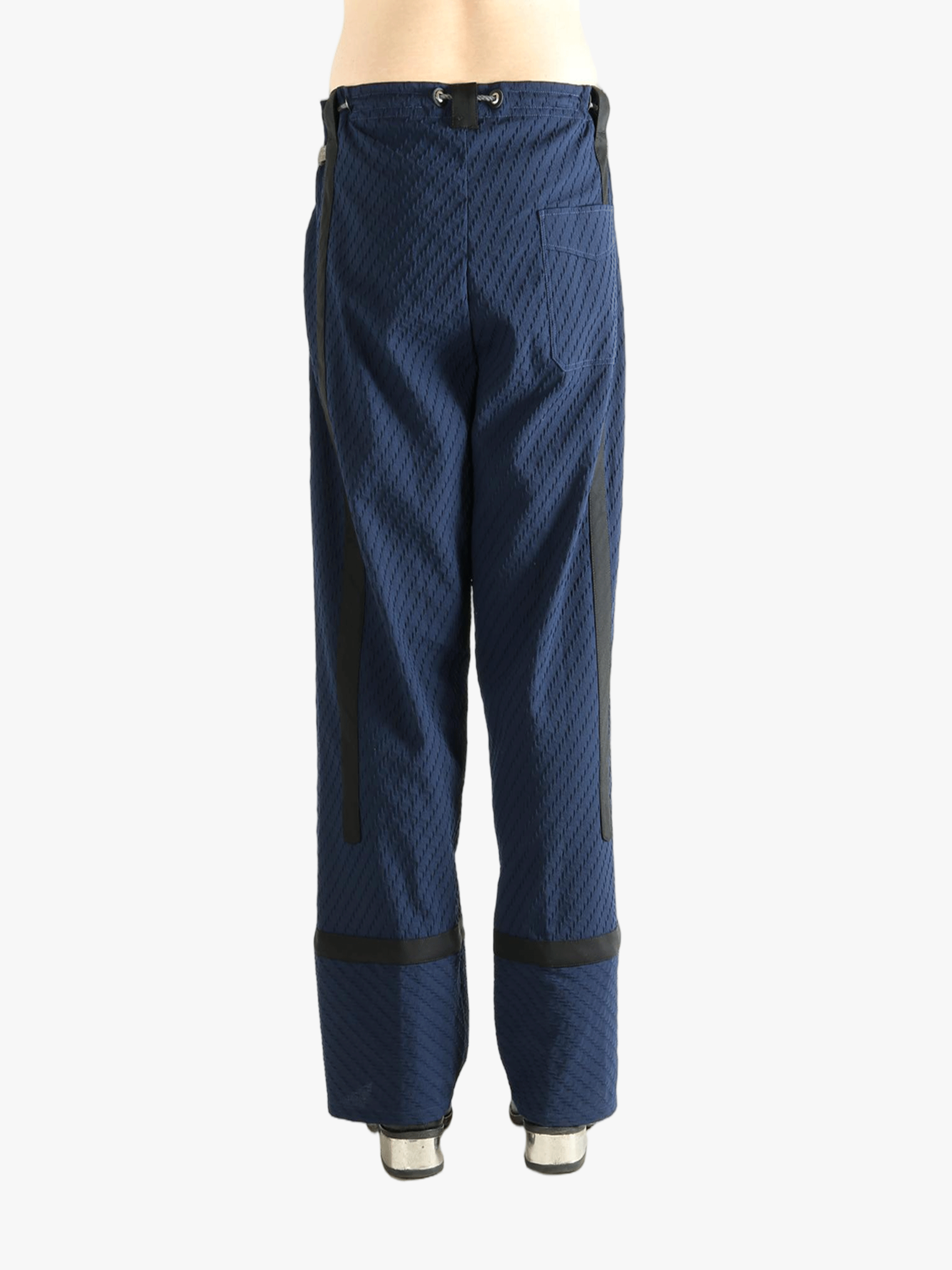 Blue pants worn by a person, showing the pants' fit
