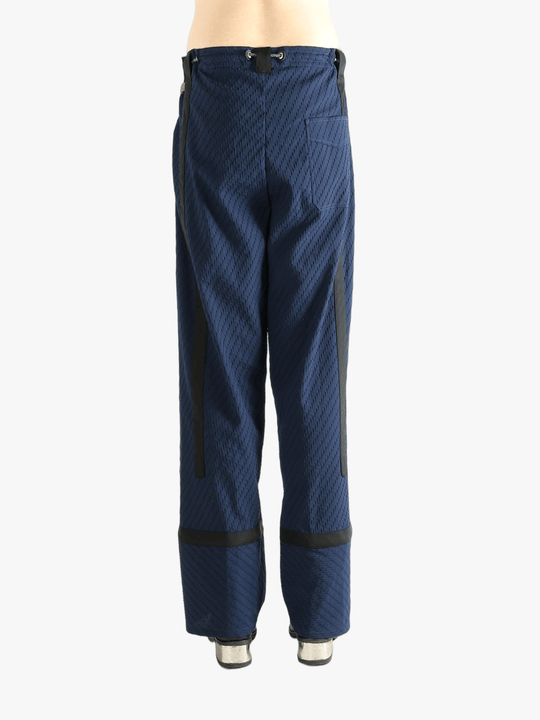 Blue pants worn by a person, showing the pants' fit