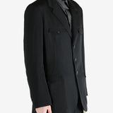 Black jacket worn by a person, showing the jacket's fit