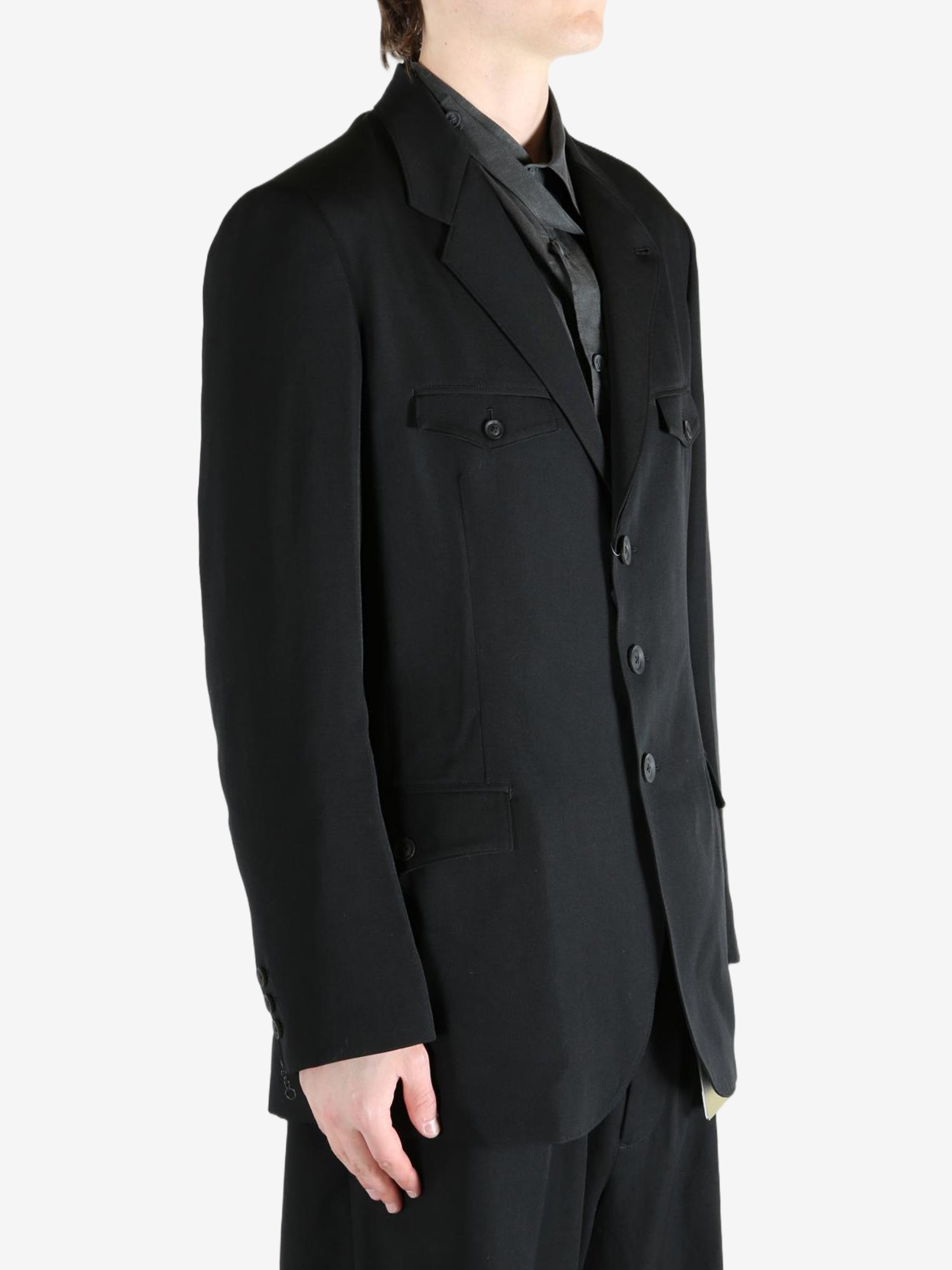 Black jacket worn by a person, showing the jacket's fit