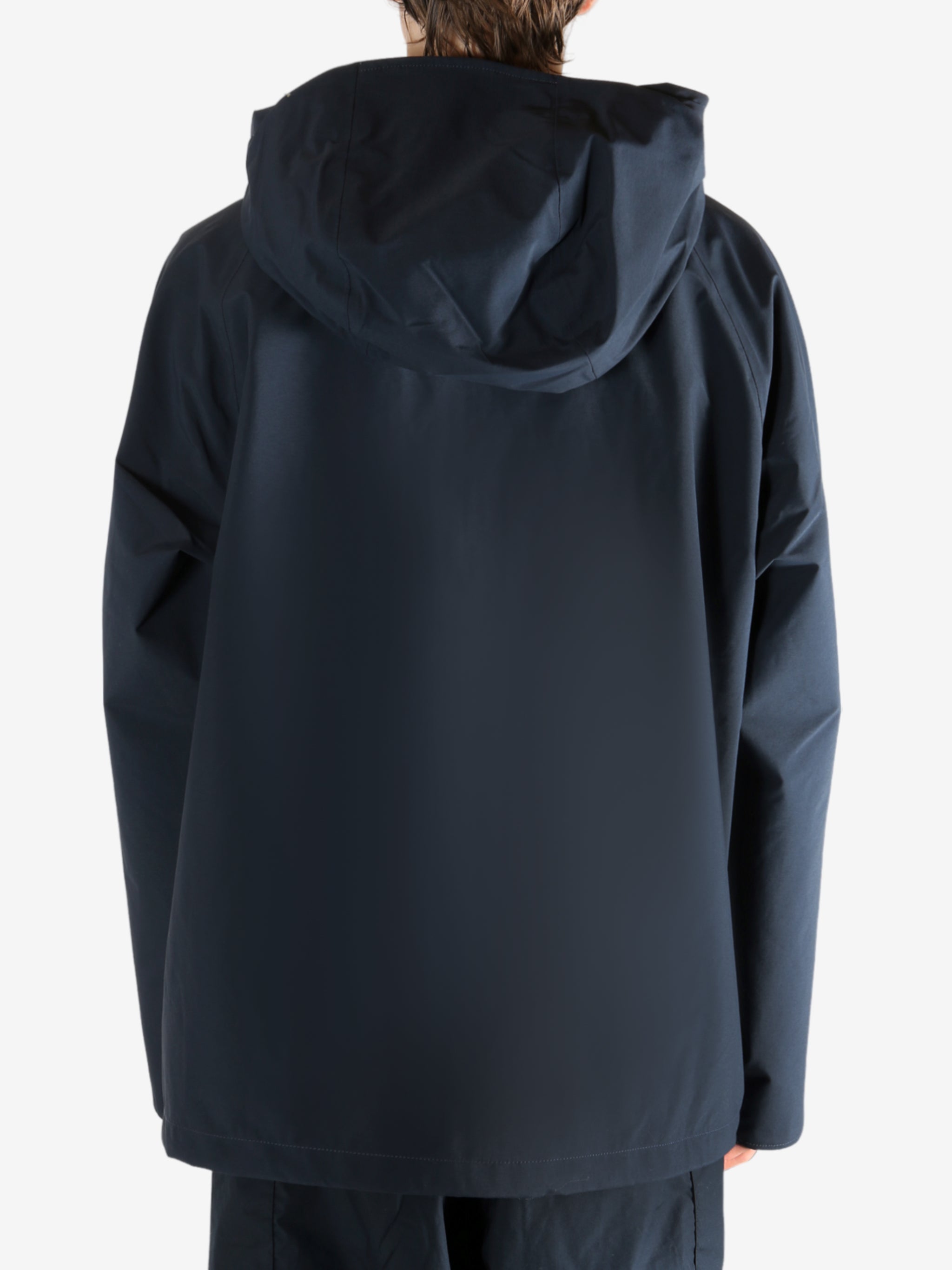 Navy jacket worn by a person, showing the jacket's fit