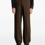 Brown pant worn by a person, showing the pant's fit