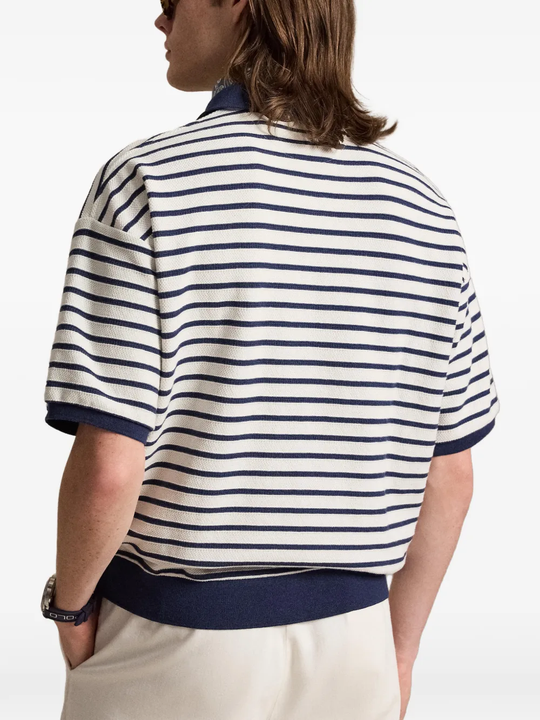 Navy shirt worn by a person, showing the shirt fit