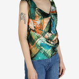 Green top worn by a person, showing the top’s fit