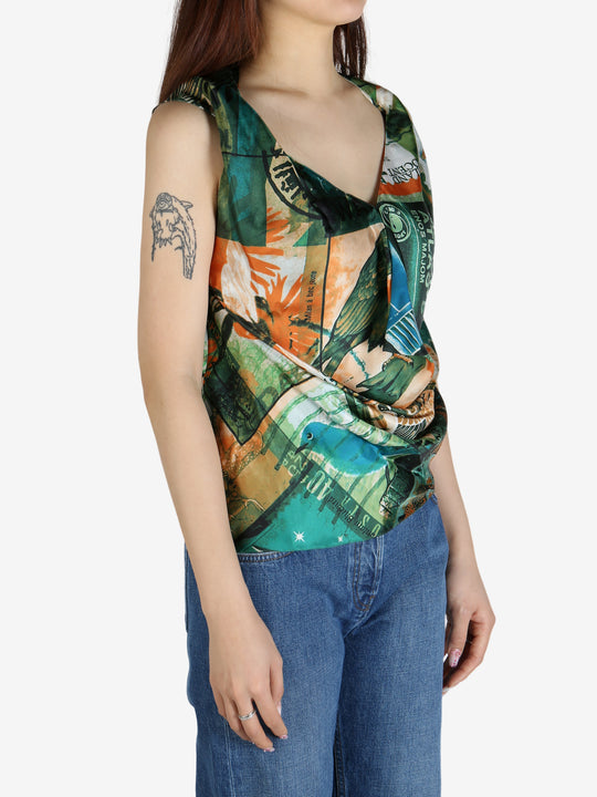 Green top worn by a person, showing the top’s fit