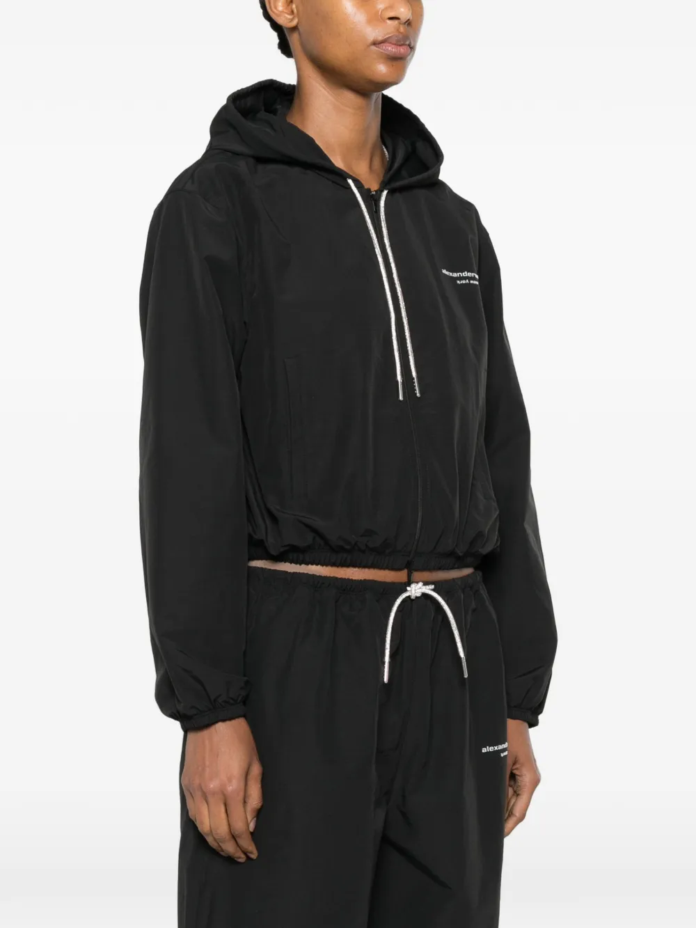 Black jacket worn by a person, showing the jacket fit