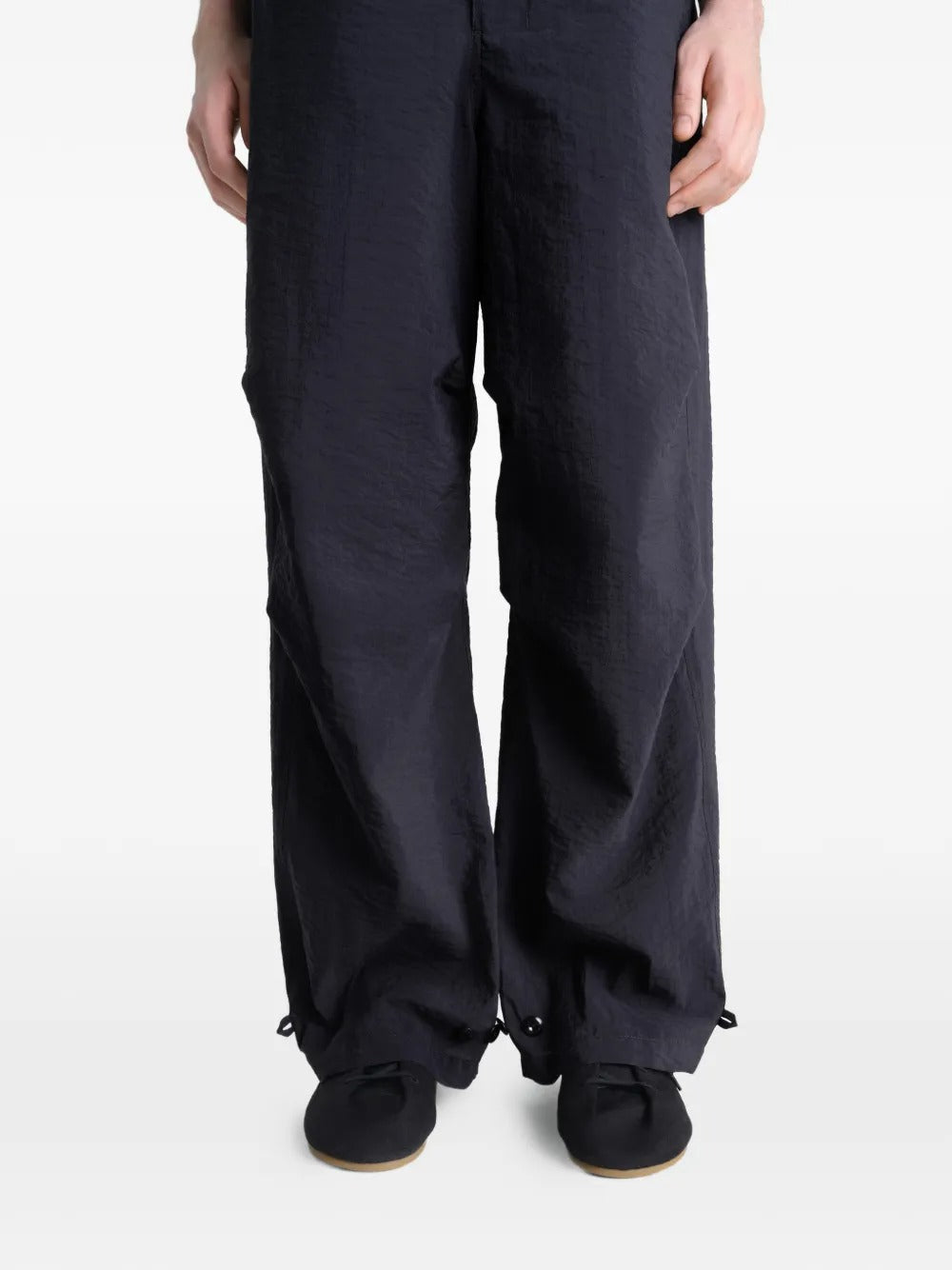 Close up of the black pants, showing texture of the cotton fabric