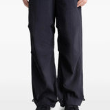 Close up of the black pants, showing texture of the cotton fabric
