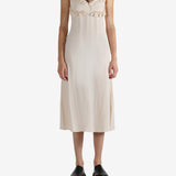 White dress worn by a person, showing the dress's fit