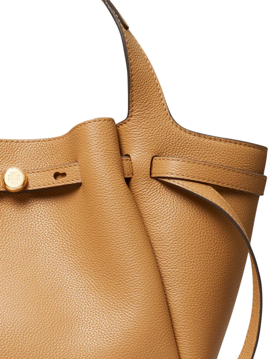 close up of brown bags, showing texture of the calf leather fabric