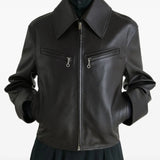 Brown jacket worn by a person, showing the jacket's fit