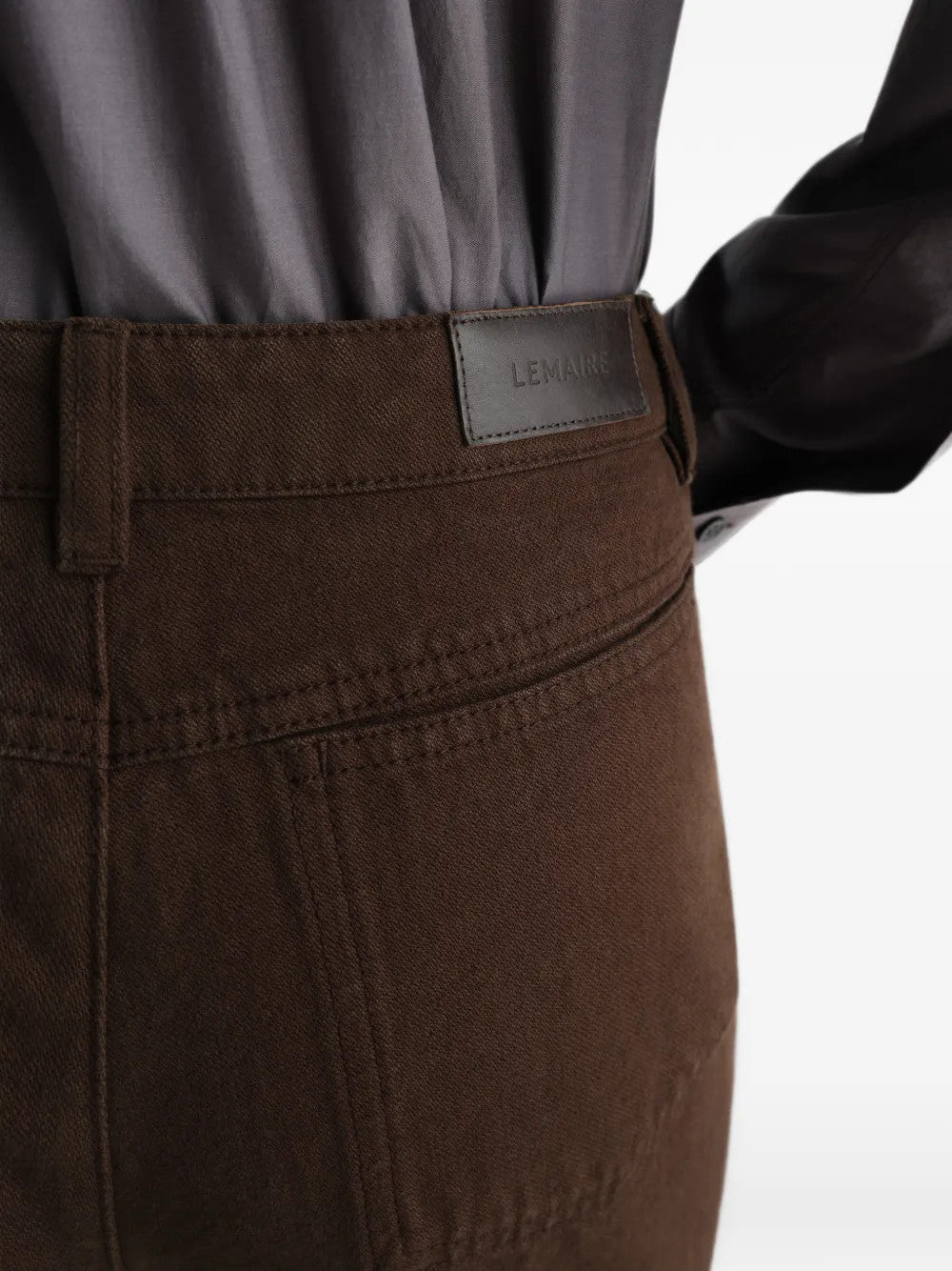 Brown pants worn by a person, showing the pants fit