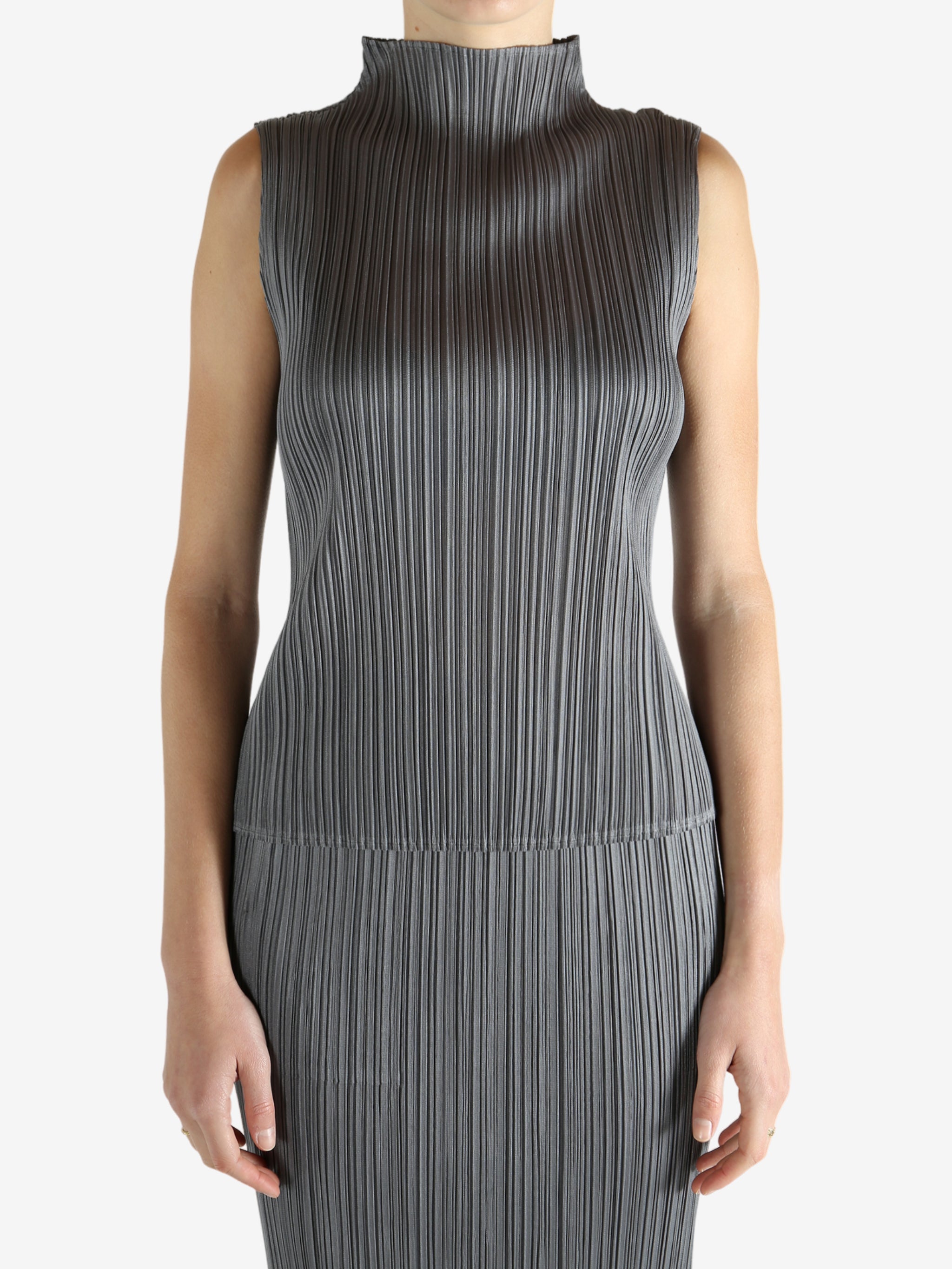 Grey shirts worn by a person, showing the shirts fit