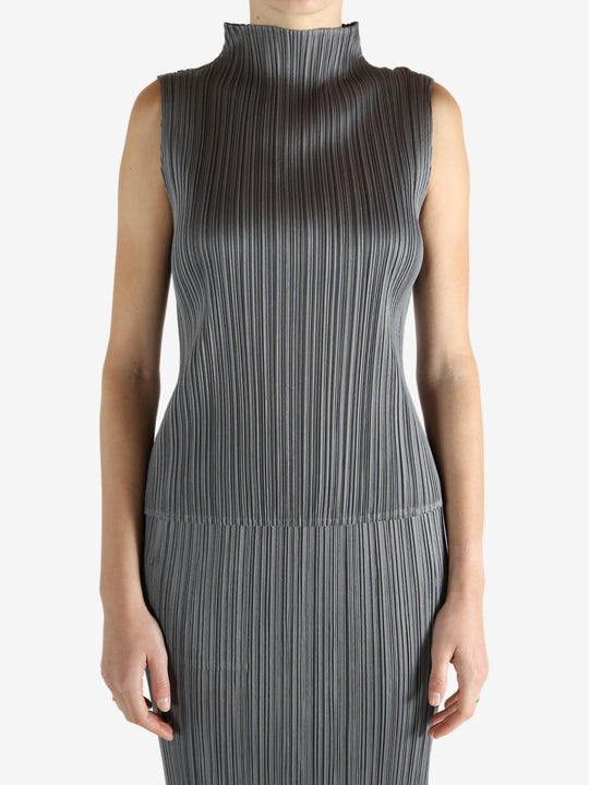 Grey shirts worn by a person, showing the shirts fit