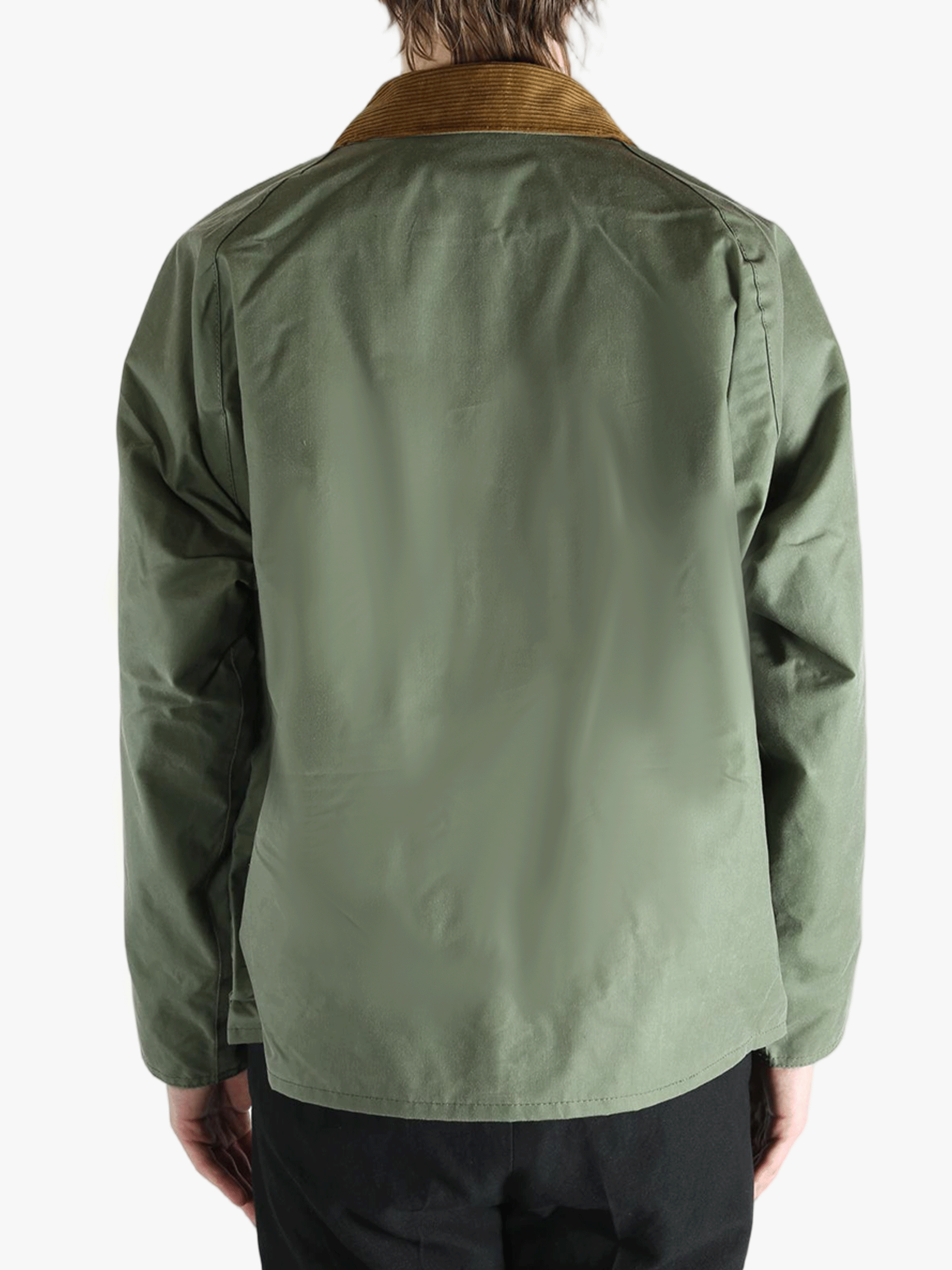 Green jacket worn by a person, showing the jacket fit