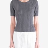 Grey shirt worn by a person, showing the shirt fit