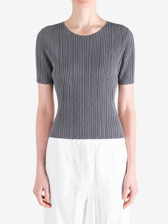 Grey shirt worn by a person, showing the shirt fit