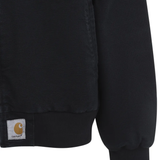 close up of black jackets-coats, showing texture of the cotton fabric 