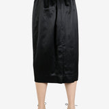 black skirt worn by a person, showing the skirt fit
