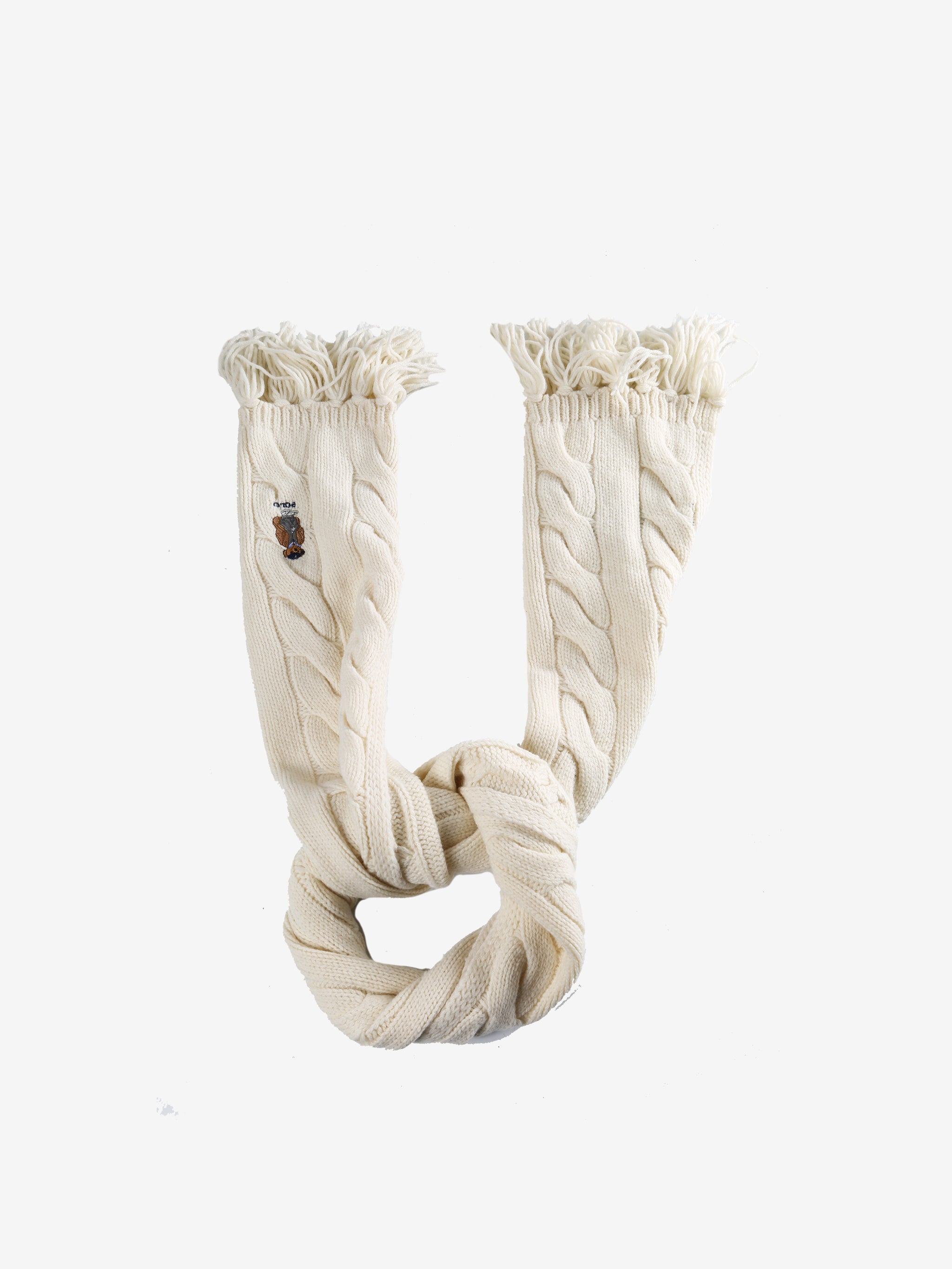 Close up of white scarves, showing texture of the merino wool and recycled nylon fabric