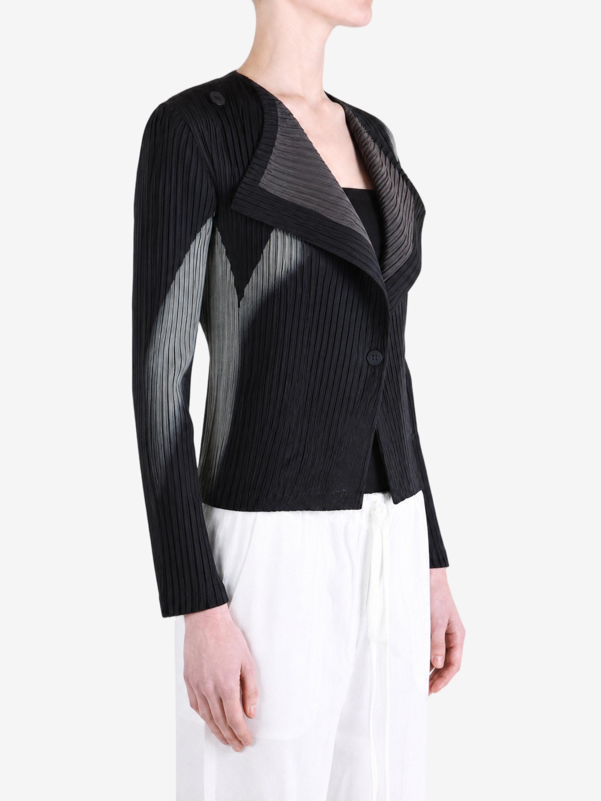 Black knitwear worn by a person, showing the knitwear fit