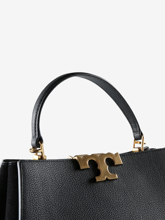 Close up of black bag, showing texture of the leather fabric