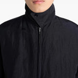 Close up of the black jacket, showing texture of the linen fabric