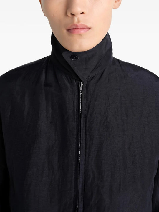 Close up of the black jacket, showing texture of the linen fabric