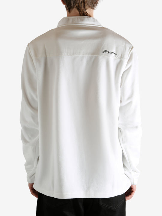 White sweatshirt worn by a person, showing the sweatshirt's fit