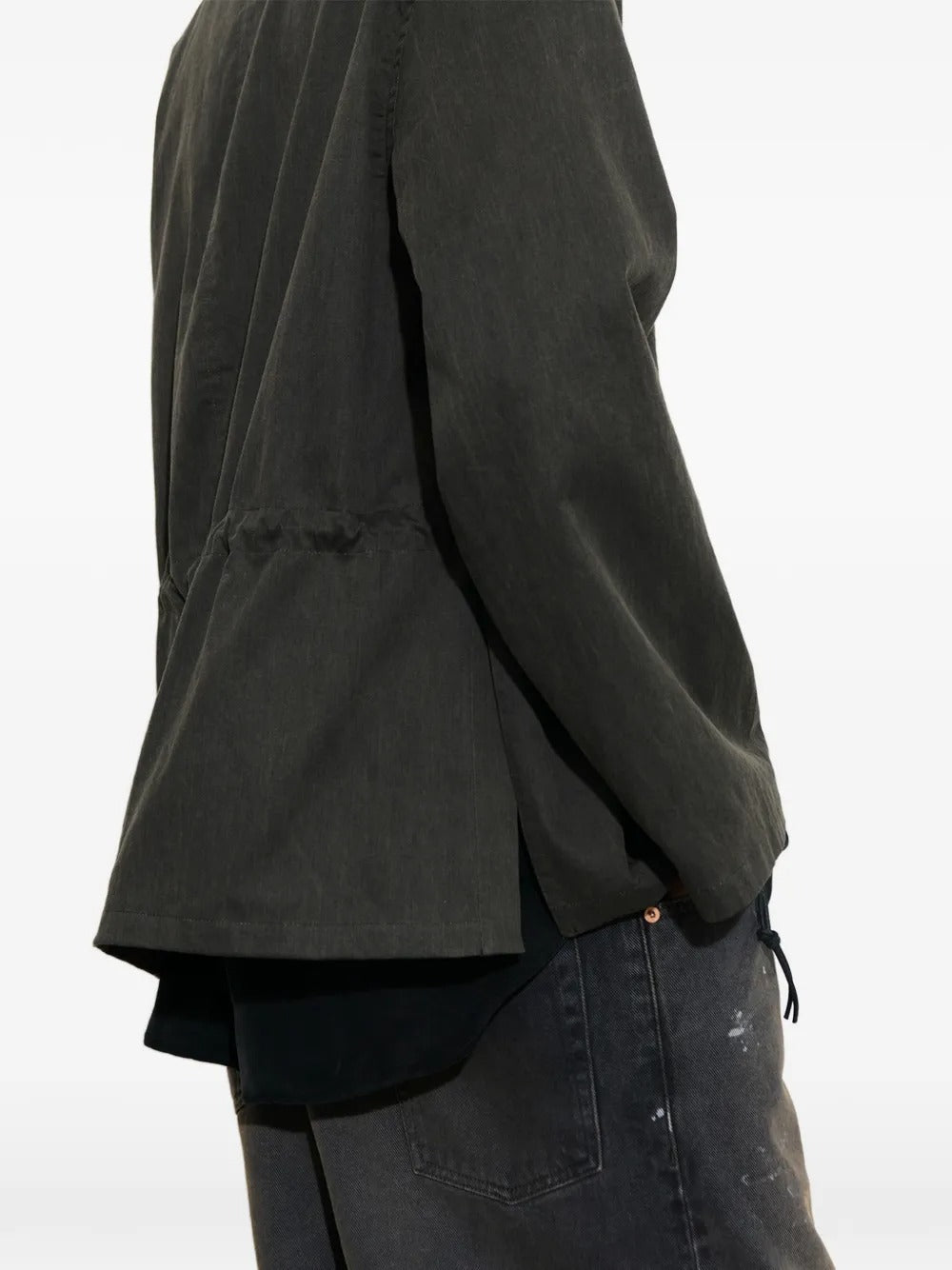Close-up of green jacket, showing texture of the cotton fabirc