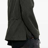 Close-up of green jacket, showing texture of the cotton fabirc