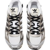 Close up of grey sneakers, showing texture of the fabric