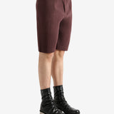 Brown shorts worn by a person, showing the short's fit