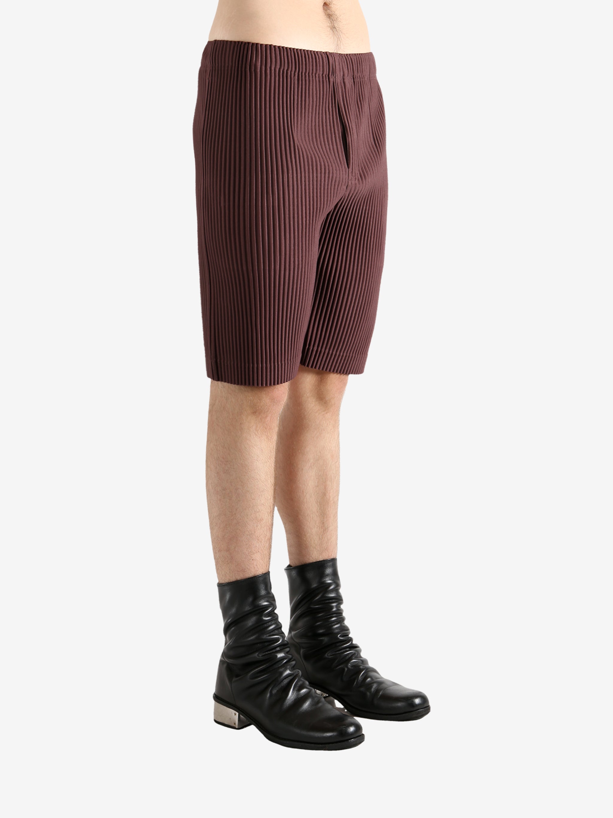 Brown shorts worn by a person, showing the short's fit