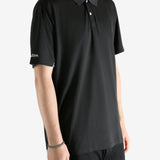 Black shirt worn by a person, showing the shirt's fit