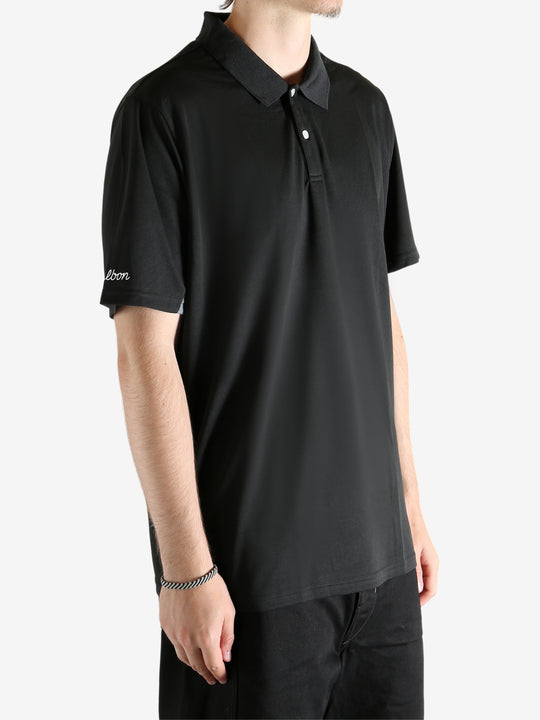 Black shirt worn by a person, showing the shirt's fit